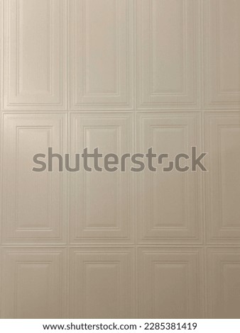 Beige tiles wall surface vintage, stock photo