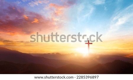 The crucifix symbol of Jesus on the mountain sunset sky background Royalty-Free Stock Photo #2285396897