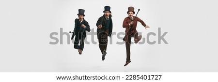 Shot of three man, gentlemen wearing old vintage suit and rushing on business over white background. Banner with copy space. Concept of historical remake, comparison of eras, retro, vintage, emotions