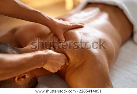 Close-up of man getting massage Royalty-Free Stock Photo #2285414851
