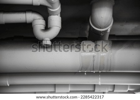 PVC Water leak pipe, Building Drainage pipes crack seep problem need to fix Royalty-Free Stock Photo #2285422317
