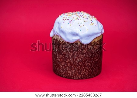 one Easter cake on a red isolated background