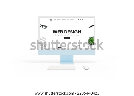 Isolated white computer display monitor with a web design studio concept page in front view. Keyboard and mouse beside. Showcasing website design concept