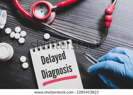 Notepad with the text Delayed Diagnosis on desk. Medical background, top view. Royalty-Free Stock Photo #2285453823