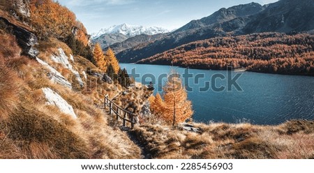 Stunning nature scenery, Amazing beautiful landscape view of rocks hill in sunny mountains over the calm water of Sils lake. beautiful place background. Travel, adventure concept. picture of wild area