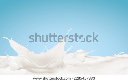 Realistic milk splash, splashing in milk pool with isolated on blue background. Royalty-Free Stock Photo #2285457893