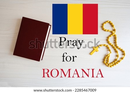 Pray for Romania. Rosary and Holy Bible background. Royalty-Free Stock Photo #2285467009