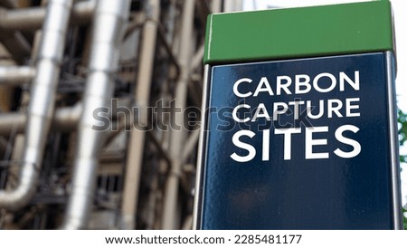 Carbon Capture sites on a sign in front of an Industrial building	 Royalty-Free Stock Photo #2285481177