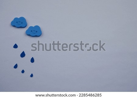 Rainy clouds over white background, photographed from above, rainy clouds in blue colors.  space, copy,