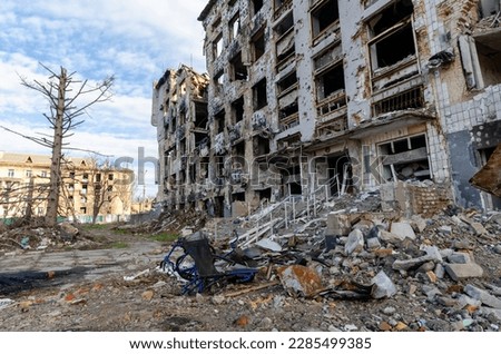 destroyed and burned houses in the city during the war in Ukraine Royalty-Free Stock Photo #2285499385