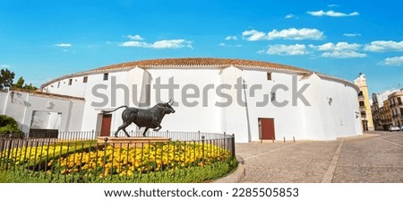  Panoramic view to bullfight arena on Plaza de Toros square with bronze sculpture in Ronda. Malaga province, Andalusia, Spain    Royalty-Free Stock Photo #2285505853