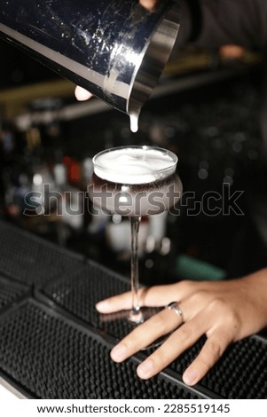 Image of barista making cocktails