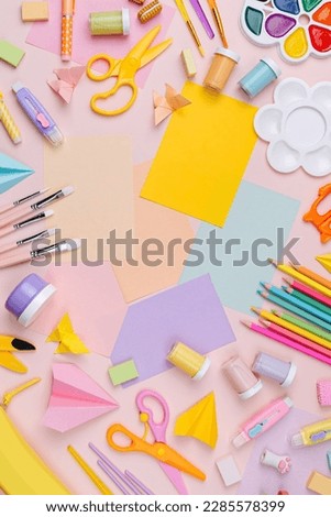 Pink pastel background with various colorful material for creativity and art activity.  Stationery and supplies for drawing and craft with 
copy space.  Primary School or kindergarten. Royalty-Free Stock Photo #2285578399