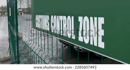 A green sign with the inscription "customs control zone". Crossing the land border between countries