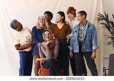 Portrait of cheerful mixed age range multi ethnic women celebrating International Women's Day Royalty-Free Stock Photo #2285614211