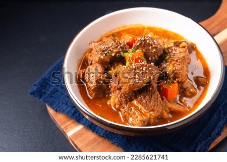 Food concept Korean spicy Beef stew on black background with copy space Royalty-Free Stock Photo #2285621741