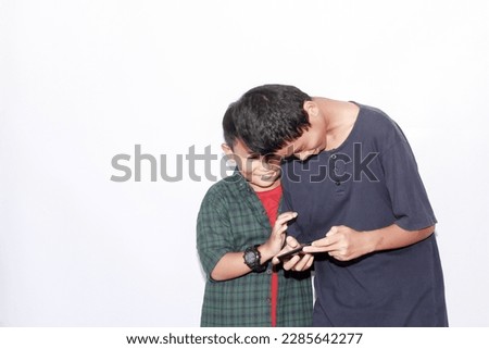 two asian child boy using phone, isolated white background