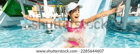 Happy child playing in swimming pool. Summer vacation concept