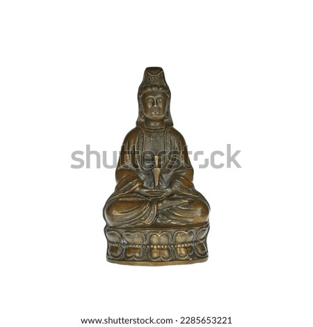 Brass figurine of the Chinese goddess of mercy Guanyin on a white background.