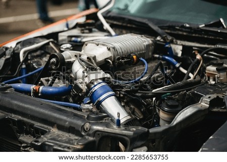 boosted car engine. turbocharged car engine. big turbocharger is on sport car engine	
 Royalty-Free Stock Photo #2285653755