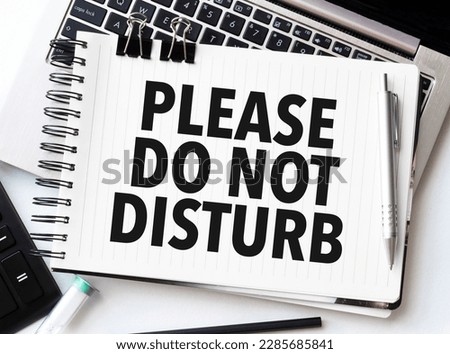 Keyboard of laptop, calculator, pencil and notepad with please do not disturb on the white background Royalty-Free Stock Photo #2285685841