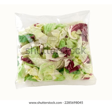 Green salad in cellophane bag. Clipping path. Royalty-Free Stock Photo #2285698045