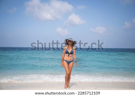 woman relaxing on beautiful tropical beach
