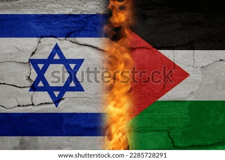 Israel Palestine war. Concept of crisis of war and political conflicts between nations. Flags. Fire, flames. Cracked stone background. Out of focus.