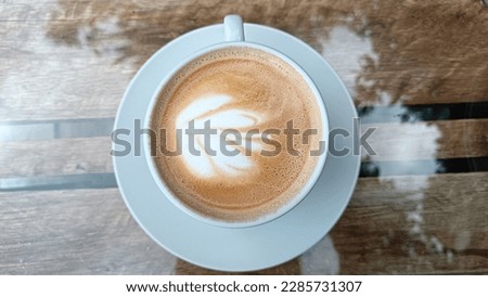 A cup of coffe  whit leaf Royalty-Free Stock Photo #2285731307