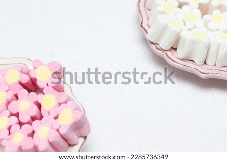 small bowls with Easter eggs and bonbons