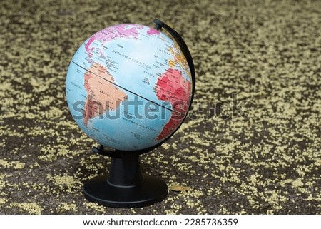 earth globe on a beige textured background