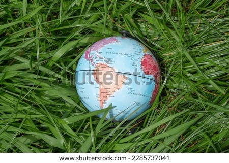earth globe on green grass - earth day