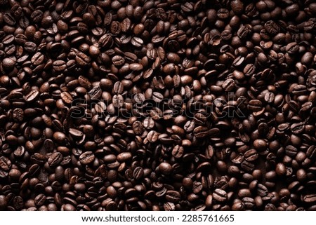Roasted Coffee beans saturated color picture beautiful background can be used as a background.