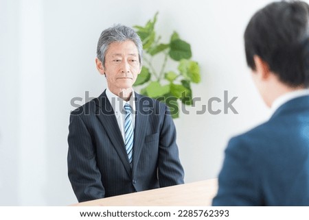 Asian businessmen in a meeting Royalty-Free Stock Photo #2285762393