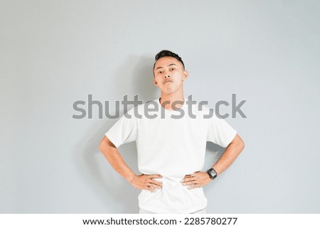 an asian youth showing a ridiculous expression
