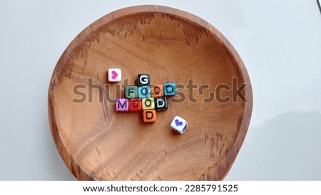 The word good food good mood is written on a plastic cube Royalty-Free Stock Photo #2285791525