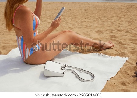 Young woman is taking selfie on the beach. Vacation concept