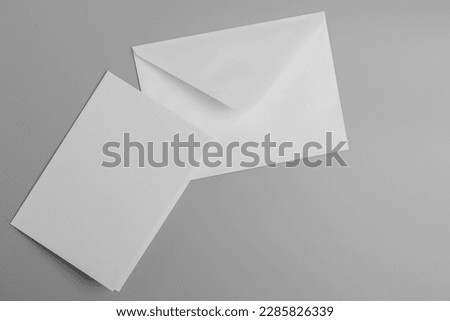 A white envelope of letters with a card
