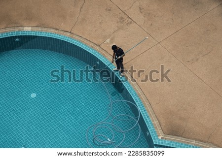The swimming pool is cleaned professionally and expertly Royalty-Free Stock Photo #2285835099