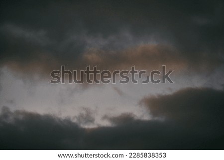 Sunset sky. The sunrise is decorated with clouds in various shapes