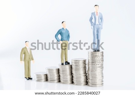 Investment merchant puppet model and coin of white background