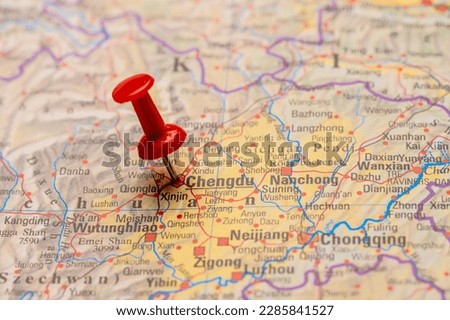 Red map pin on a map of Chengdu.