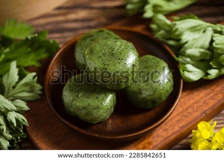 Oriental Chinese Sweet Green Rice Ball,Qingming festival snack. Royalty-Free Stock Photo #2285842651
