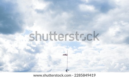 cloudy sky and one flag