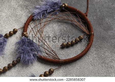 Dream catcher on black and white background, closeup