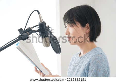 Asian female voice actors recording in the studio Royalty-Free Stock Photo #2285882151