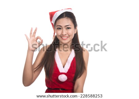 Portrait of beautiful Asian girl(Asian woman) wearing Santa Claus clothes,Santa girl,Christmas girl,x-mas,winter,happiness concept,woman showing OK gesture,emotion s,isolated on white background
