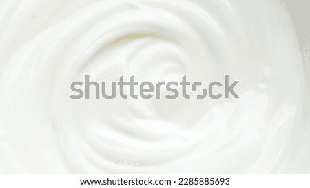 Close up of white natural creamy yogurt. Royalty-Free Stock Photo #2285885693
