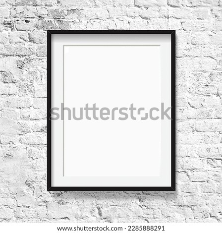 blank picture frame on white brick wall, mock up for adding your design
