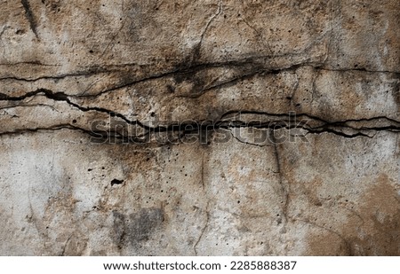 Old cracked broken wall cement surface texture background.